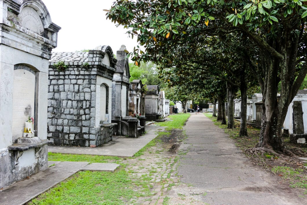 A row of above ground graves at Lafayette Cemetery No. 1 on a cloudy day