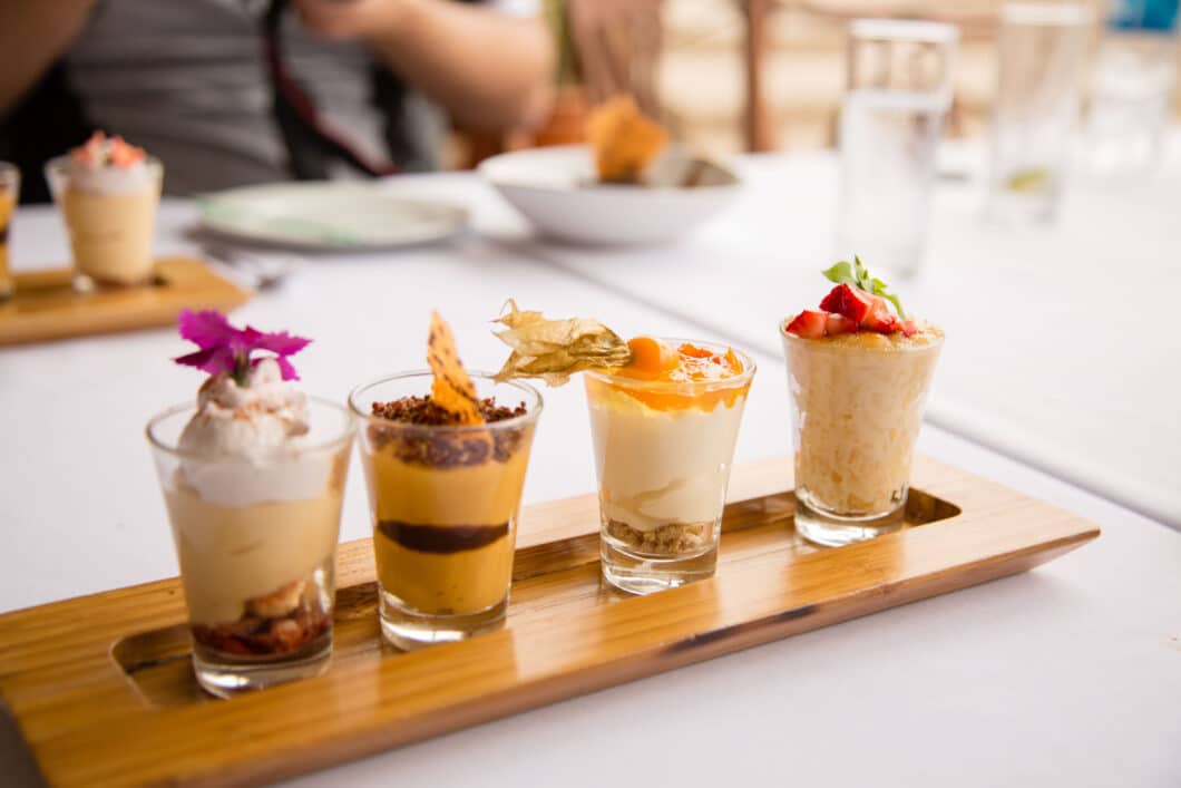 A tray of desserts on a wooden table as part of the Lima Food Tour.