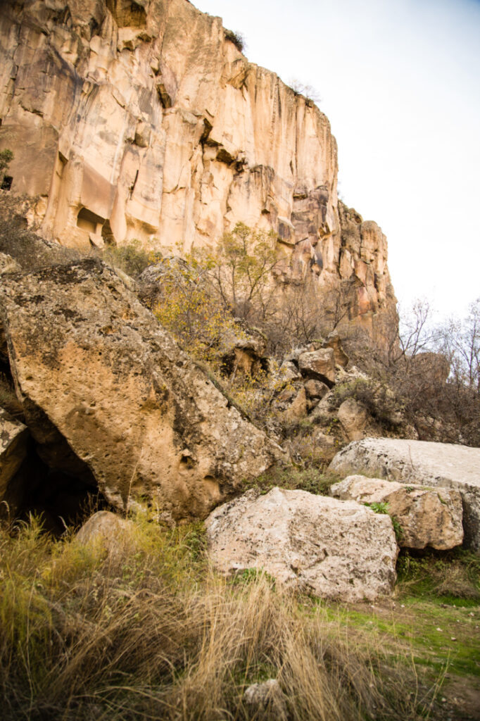 A rock formation with a cave in it.