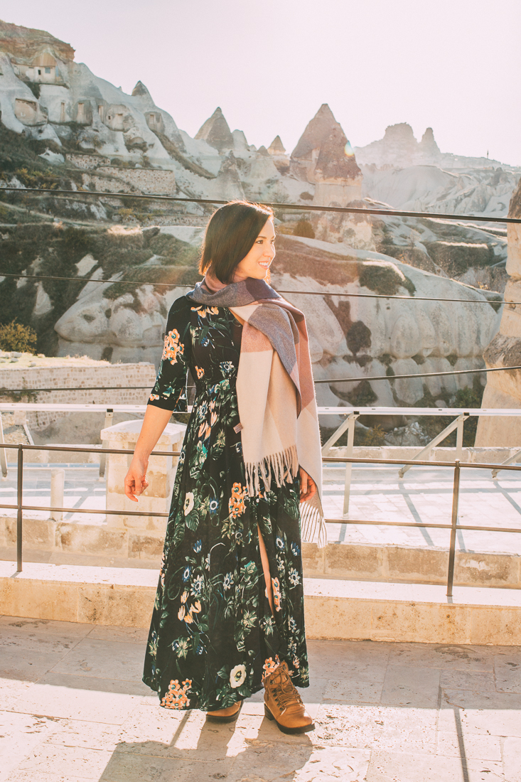 A woman wearing a Milumia floral print flowy maxi dress.