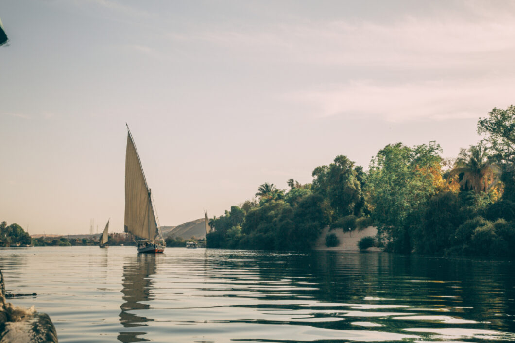 A felucca sailing along the Nile river near the Nubian Village in Egypt.