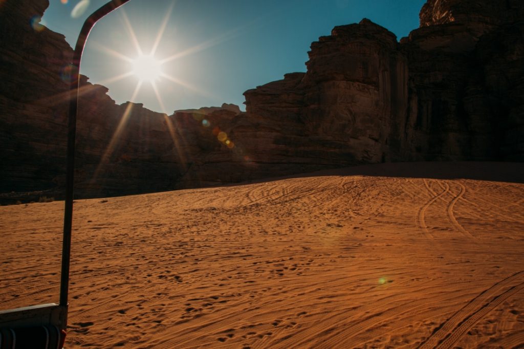 A view of the large rock formations in the Wadi Rum desert from the back of truck.