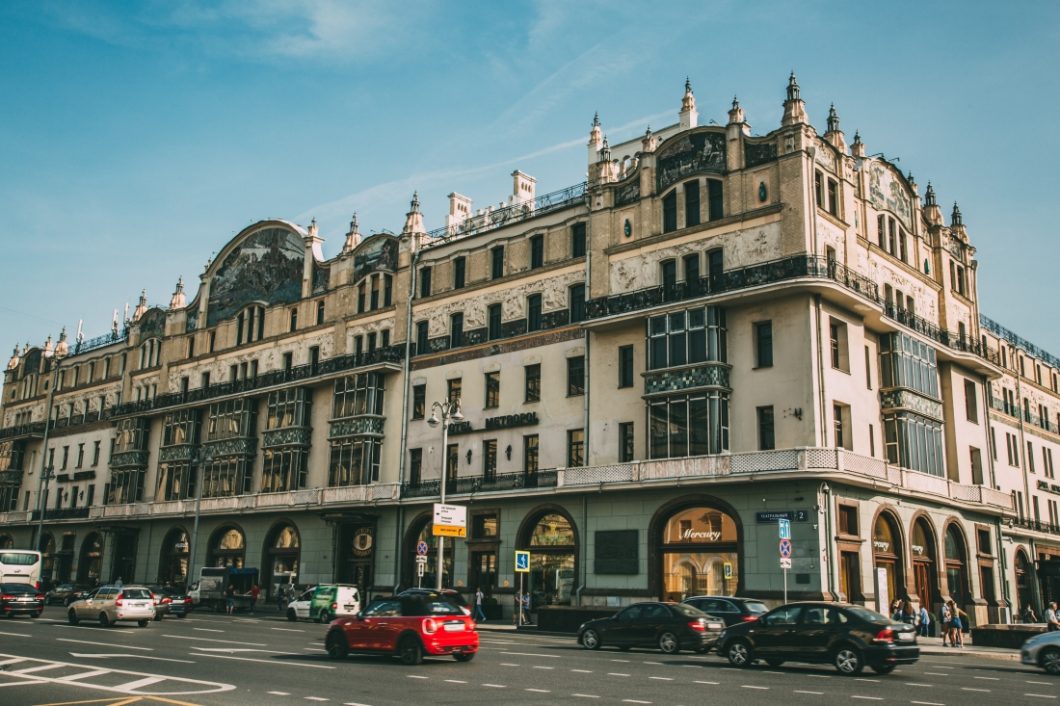 The outside facade of the Metropol Hotel in Moscow -- where the book "A Gentleman in Moscow" takes place. The gorgeous stone facade occupies a whole city block, and is multiple stories high, located on a busy Moscow street.