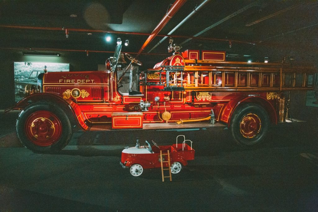 A classic 1924 Seagrave fire truck on display under spotlights at the Heydar Aliyev Center’s Classic Car Exhibit in Baku, Azerbaijan.