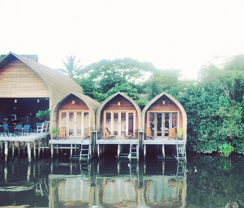 3 Bamboo Bungalows in Kampot, Cambodia next to an open restaurant