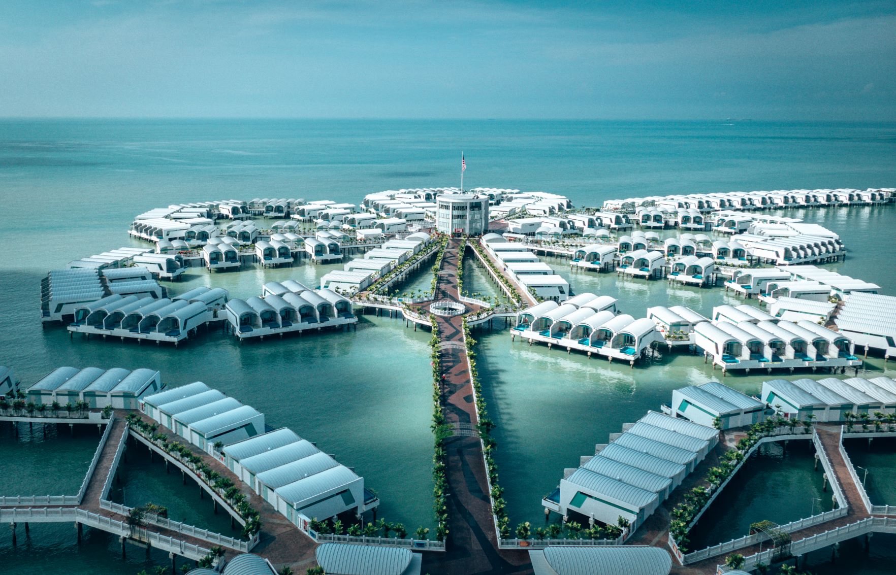 Lexis Hibiscus, Port Dickson, Malaysia featuring white overwater bungalows in the ocean