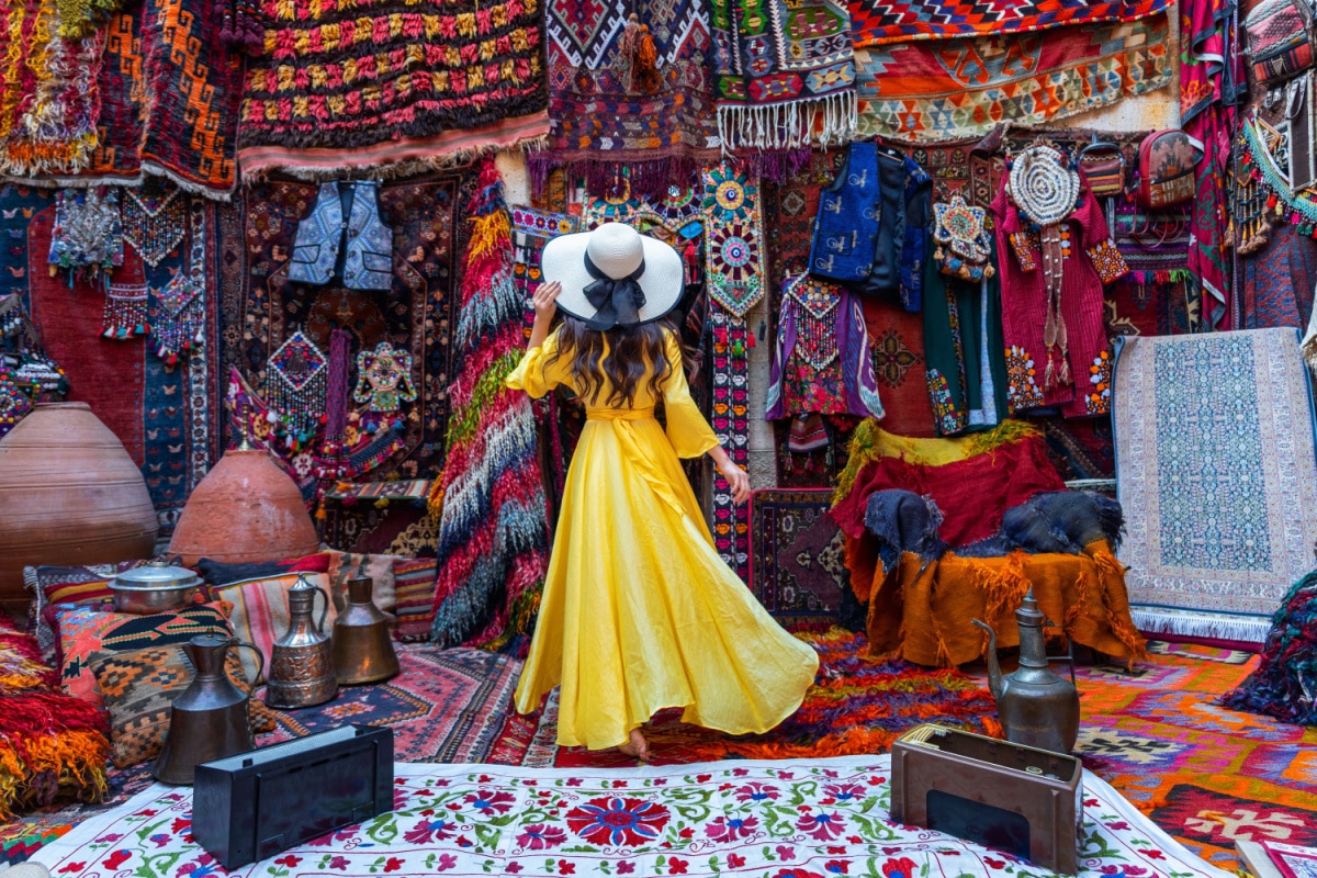 Beautiful girl at traditional carpet shop in Goreme city, Cappadocia in Turkey.