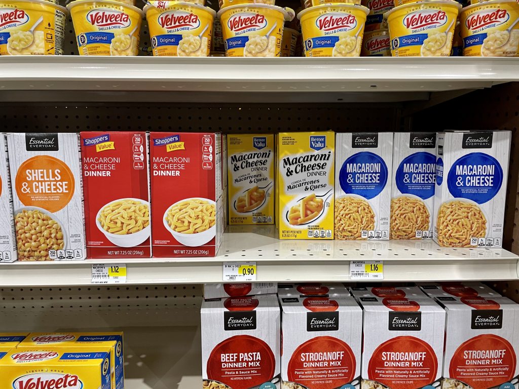 A grocery store shelf with boxed macaroni and cheese in Turks and Caicos.