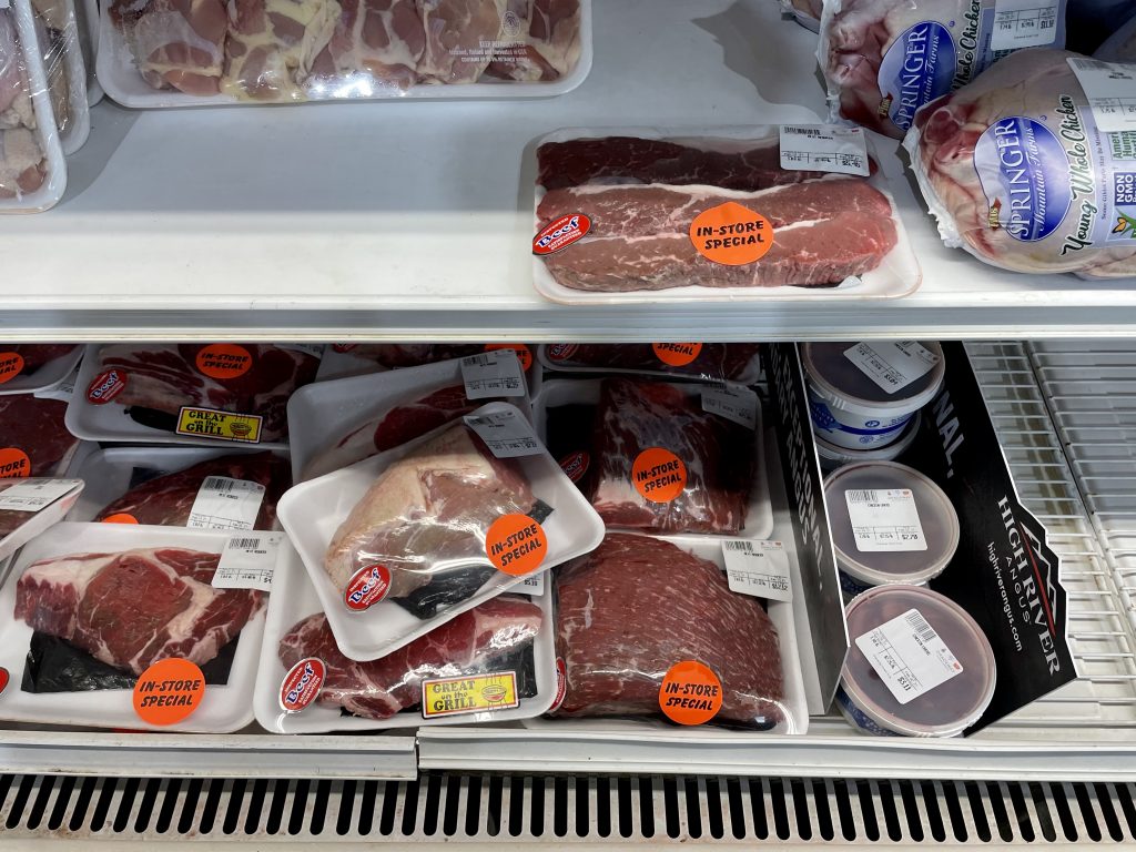 Different fresh meat being sold in a grocery store in Turks and Caicos