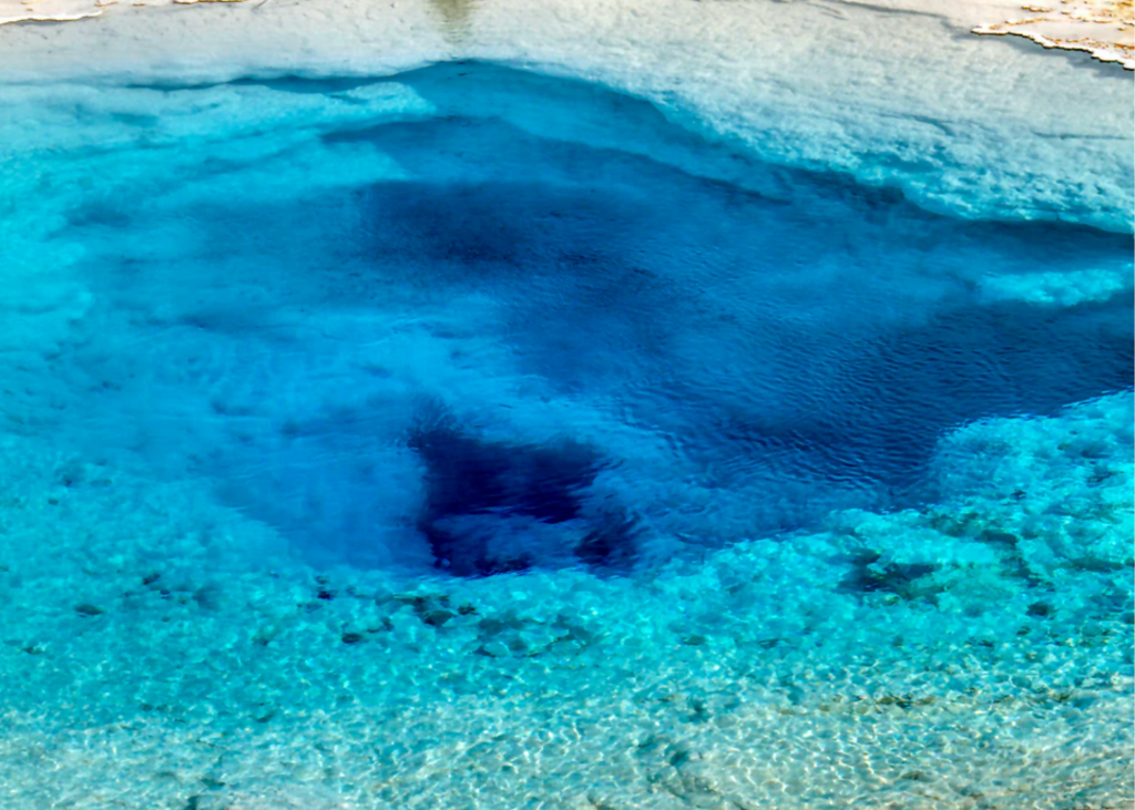 An aerial view of a blue hole in Turks and Caicos Islands.