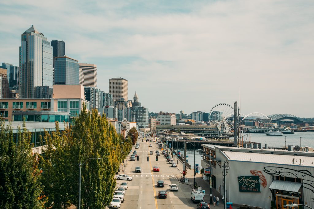 A photo of buildings and the street and Ferris wheel in Seattle