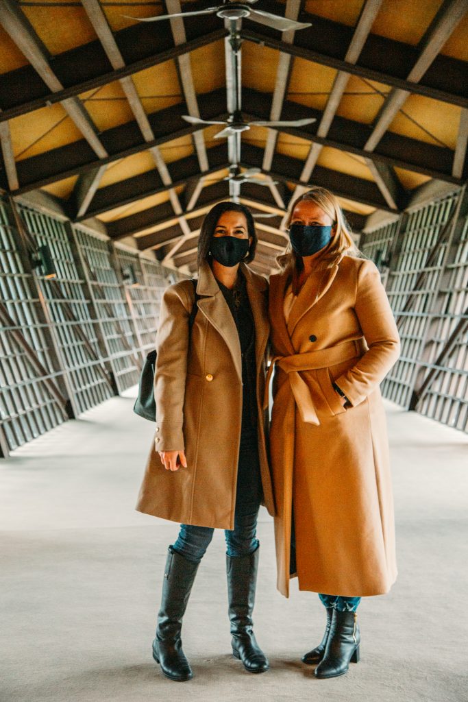 Two women wearing Chicwish coats.