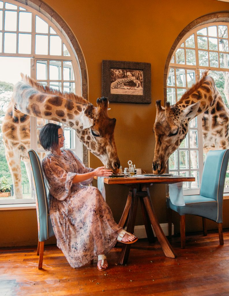 A woman wearing a Chicwish dress worn at Giraffe Manor.