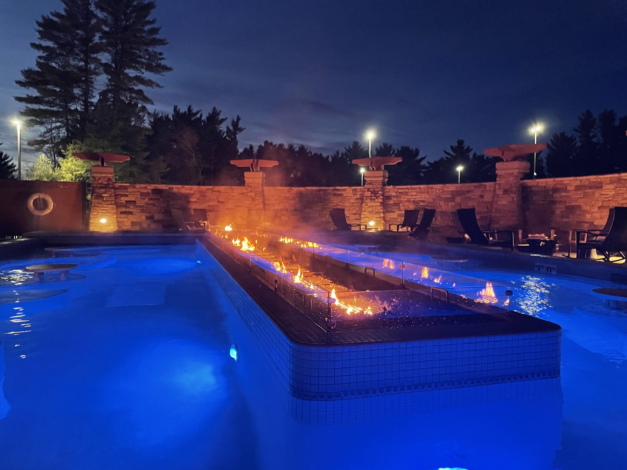 A photo of the Sundara Inn & Spa outdoor pool & fire -- a popular attraction of the adults-only spa in the Wisconsin Dells.