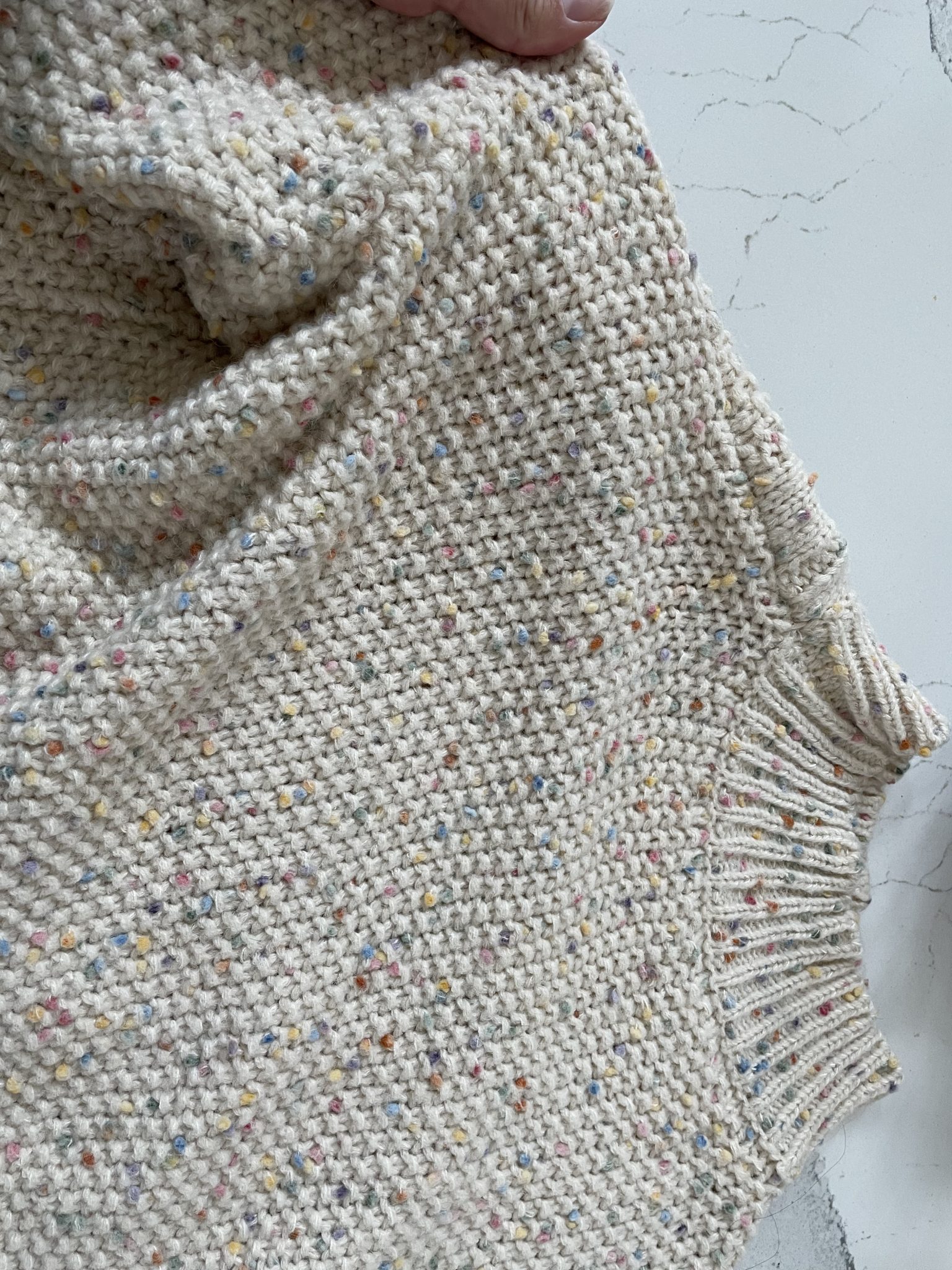 Close up of colorful dots high neck chunky knit sweater from Chicwish.