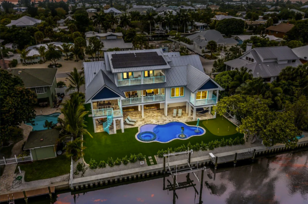 3-story Beachfront Home on Canal with Pool and Game Room