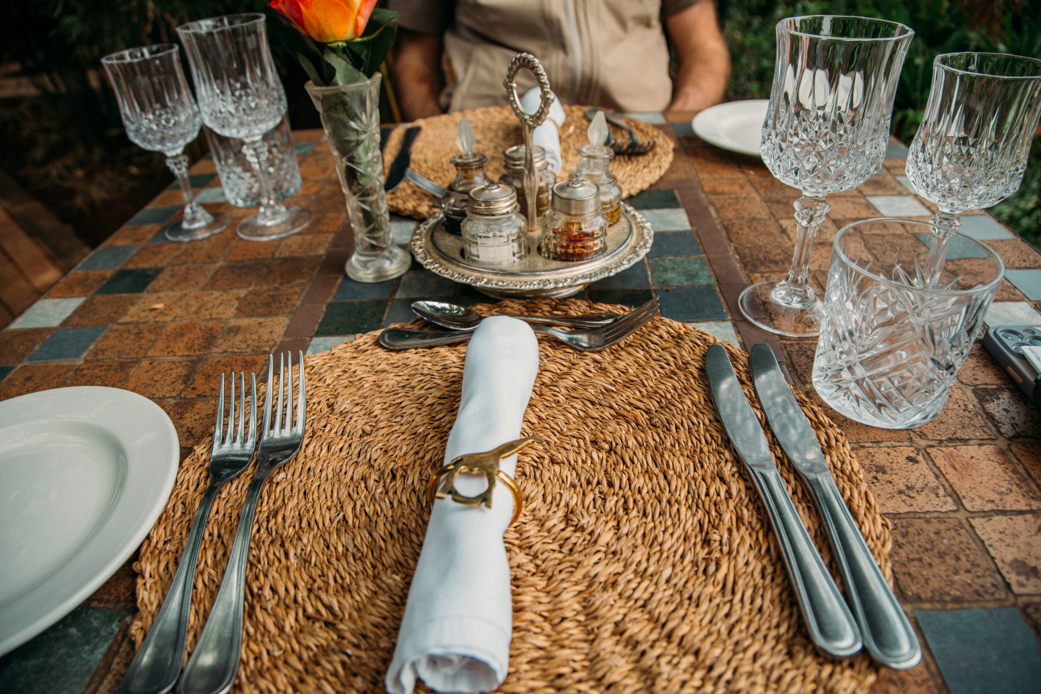 A place setting for a dinner table with giraffes on them. 