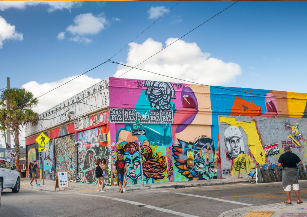 A colorful building with graffiti on the side of it.