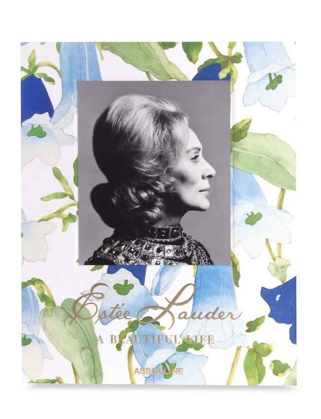 Hardcover fashion and designer book authored by Aerin and Jane Lauder along with Assouline titled Estée Lauder: A Beautiful Life with a delicate floral book cover design