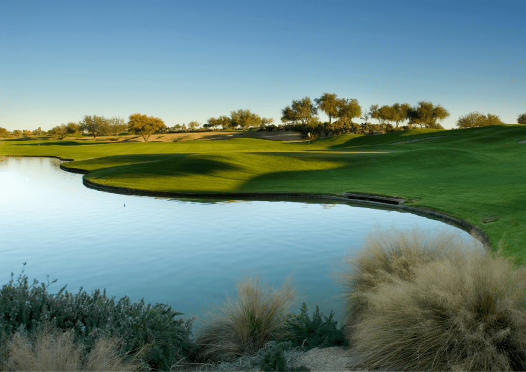 A golf course with a pond at Golf Grand Geneva Resort Golf Courses.