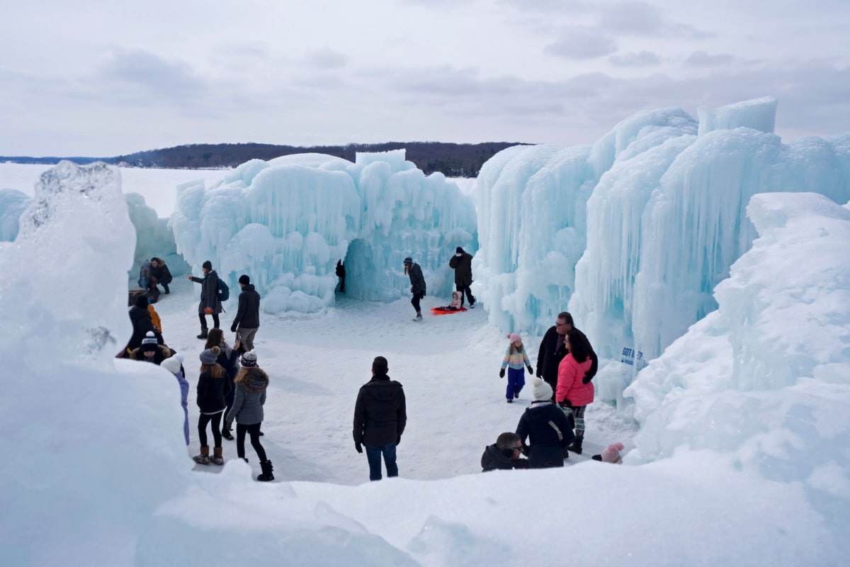 LAKE GENEVA, WISCONSIN - March 2, 2019: People enjoying the annual icy winter playland attraction at the ice castles