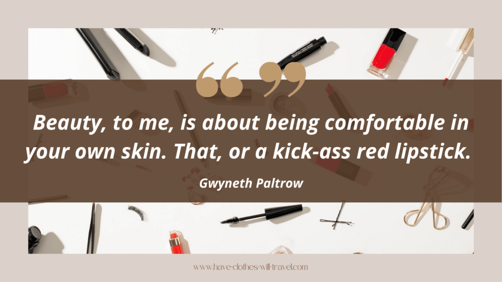 An edited graphic shows makeup products laid out on a white background. Text imposed over the image says, "Beauty, to me, is about being comfortable in your own skin. That, or a kick-ass red lipstick. - Gwyneth Paltrow"