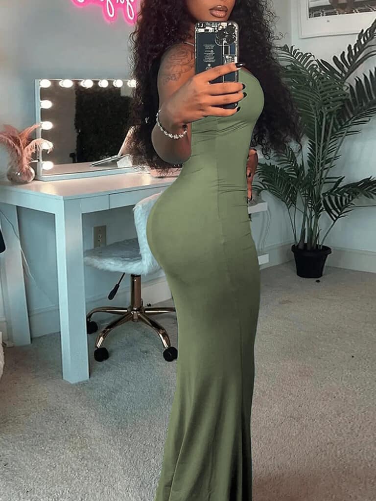 woman taking a selfie in a green maxi dress from lovelywholesale