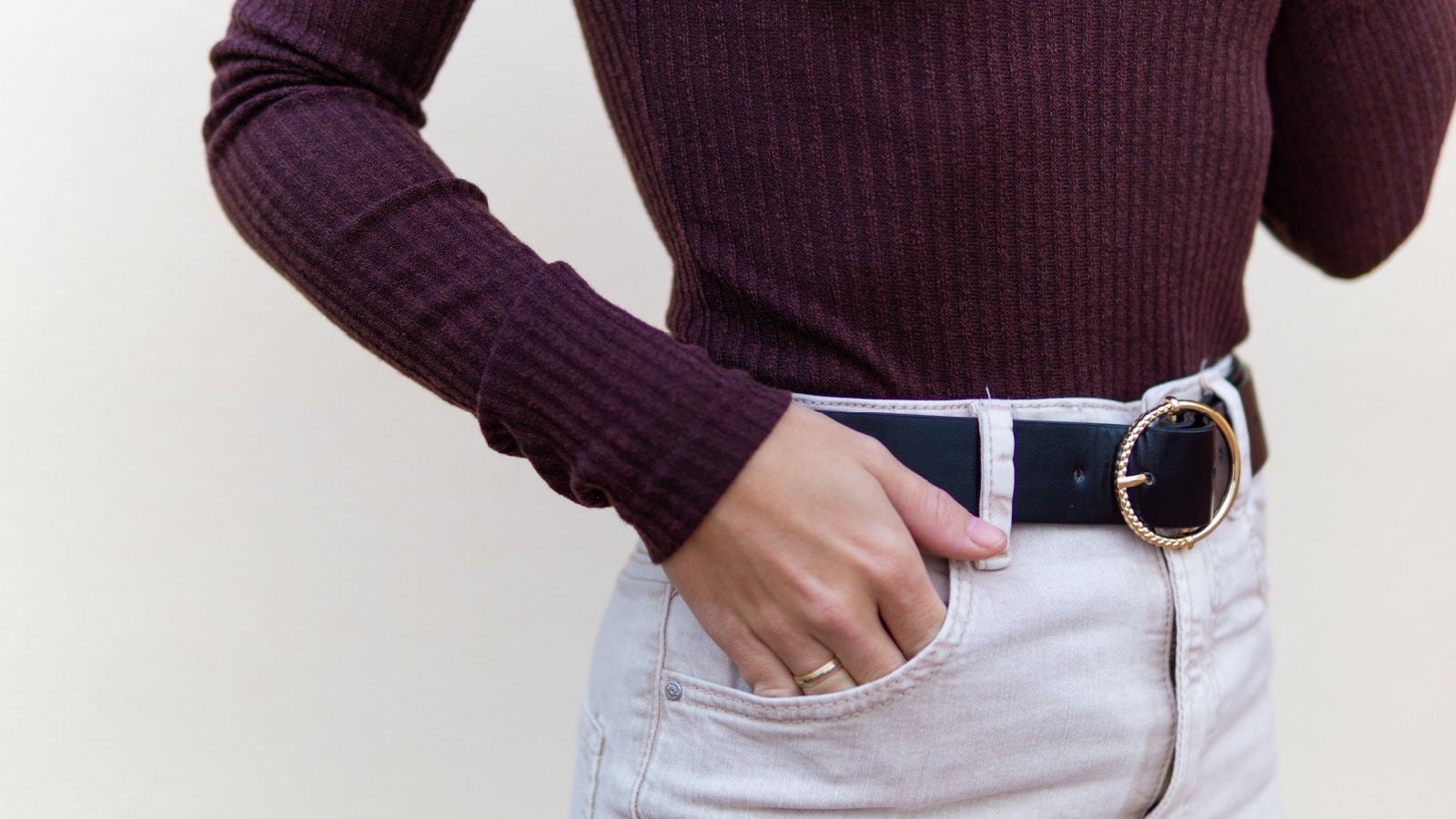 Young woman with black leather belt