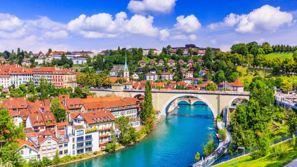 Bern, Switzerland. View of the old city center and Nydeggbrucke bridge over river Aare.