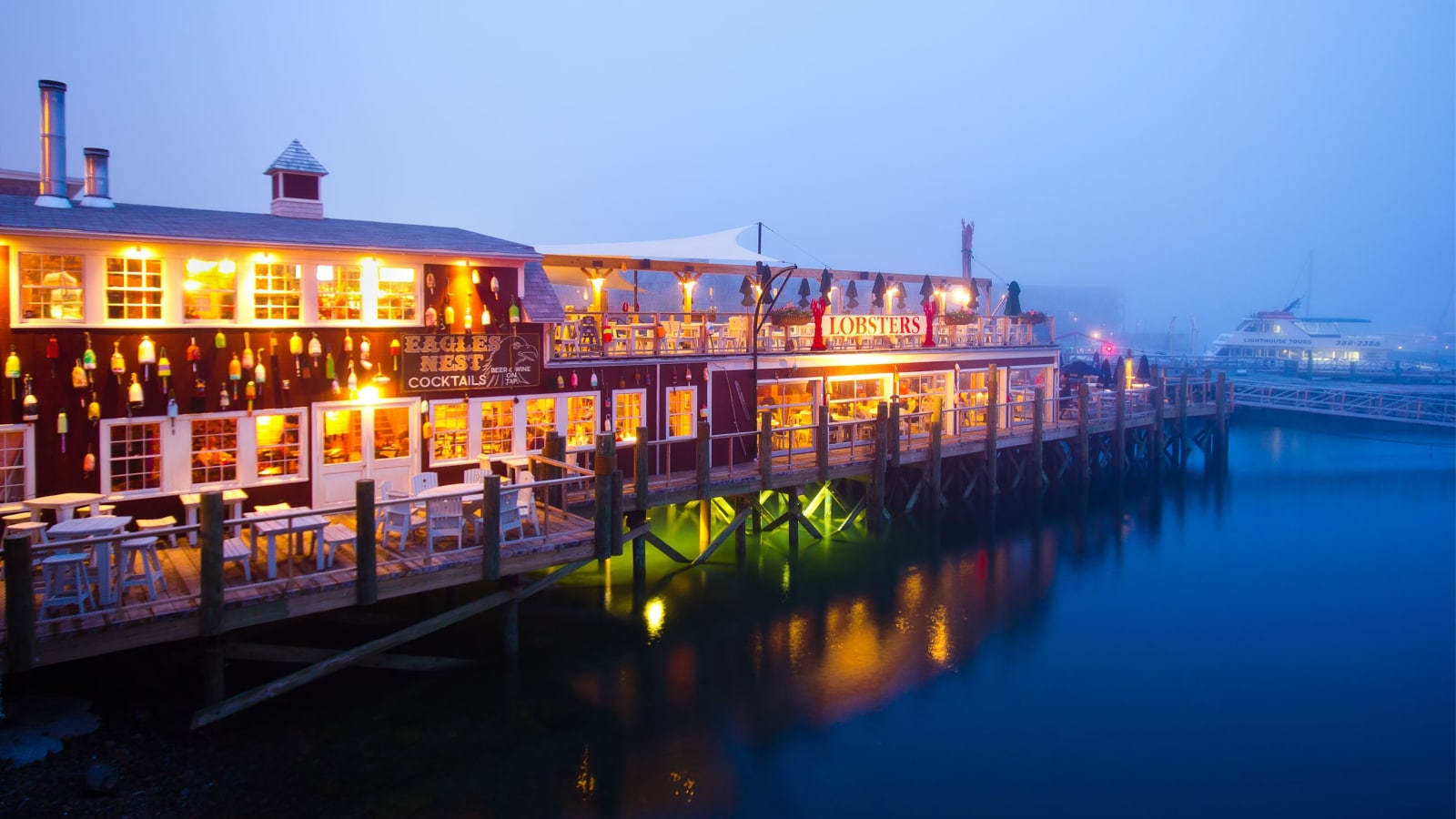 BAR HARBOR, ME - JULY 24: Dockside lobster restaurant in historic Bar Harbor ME on night of July 24, 2011. Bar Harbor is a famous location in Down East Maine with a long history of lobstering.