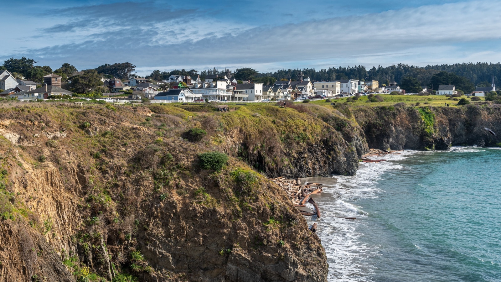 Mendocino, CA, March 8, 2020. View of town from the Mencocino Headlands State Park, USA, on a blue sky day with some clouds.