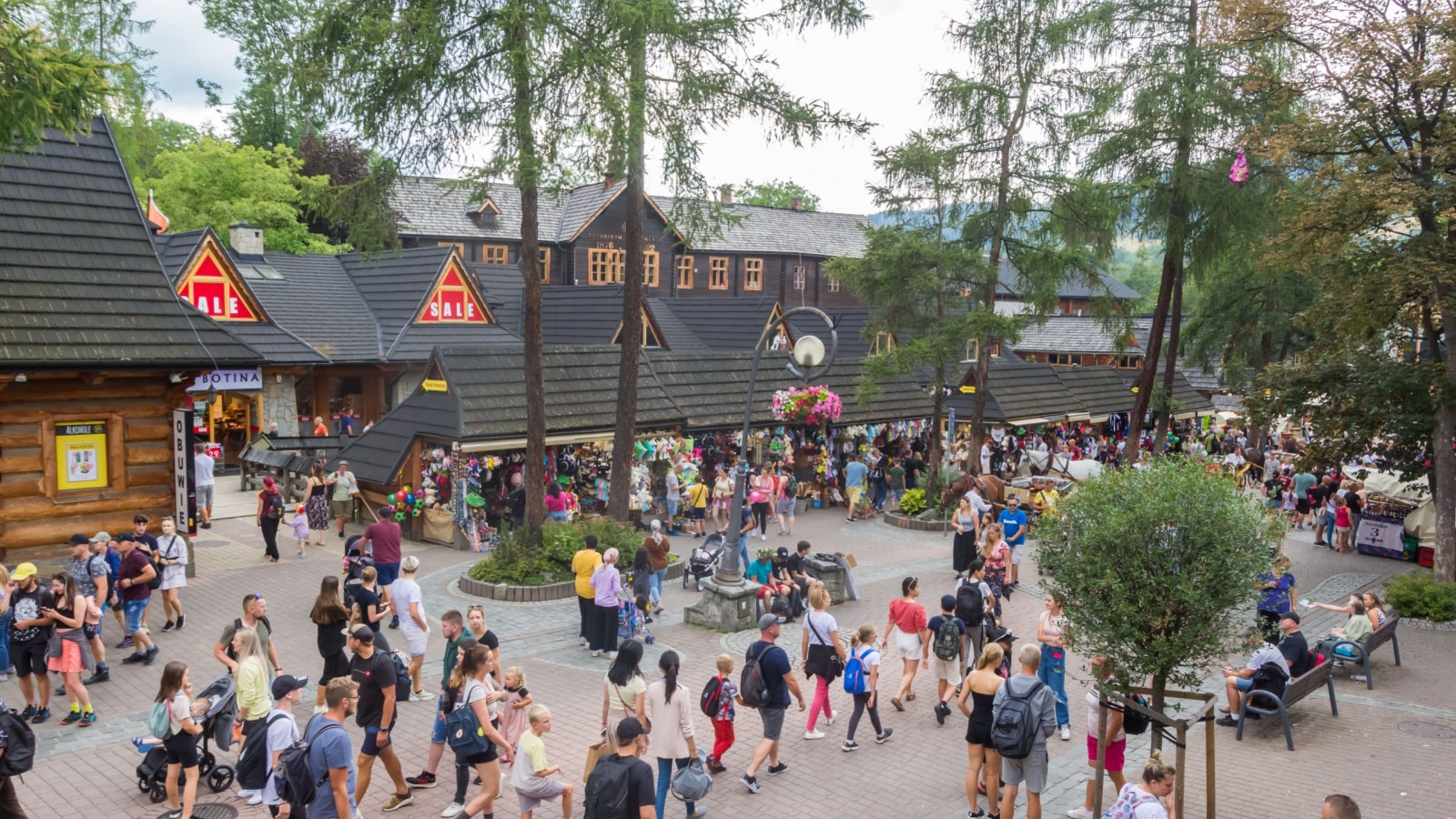 ZAKOPANE, POLAND - JULY 27, 2022: Main street with souvenir shops and restaurants in Zakopane, Poland