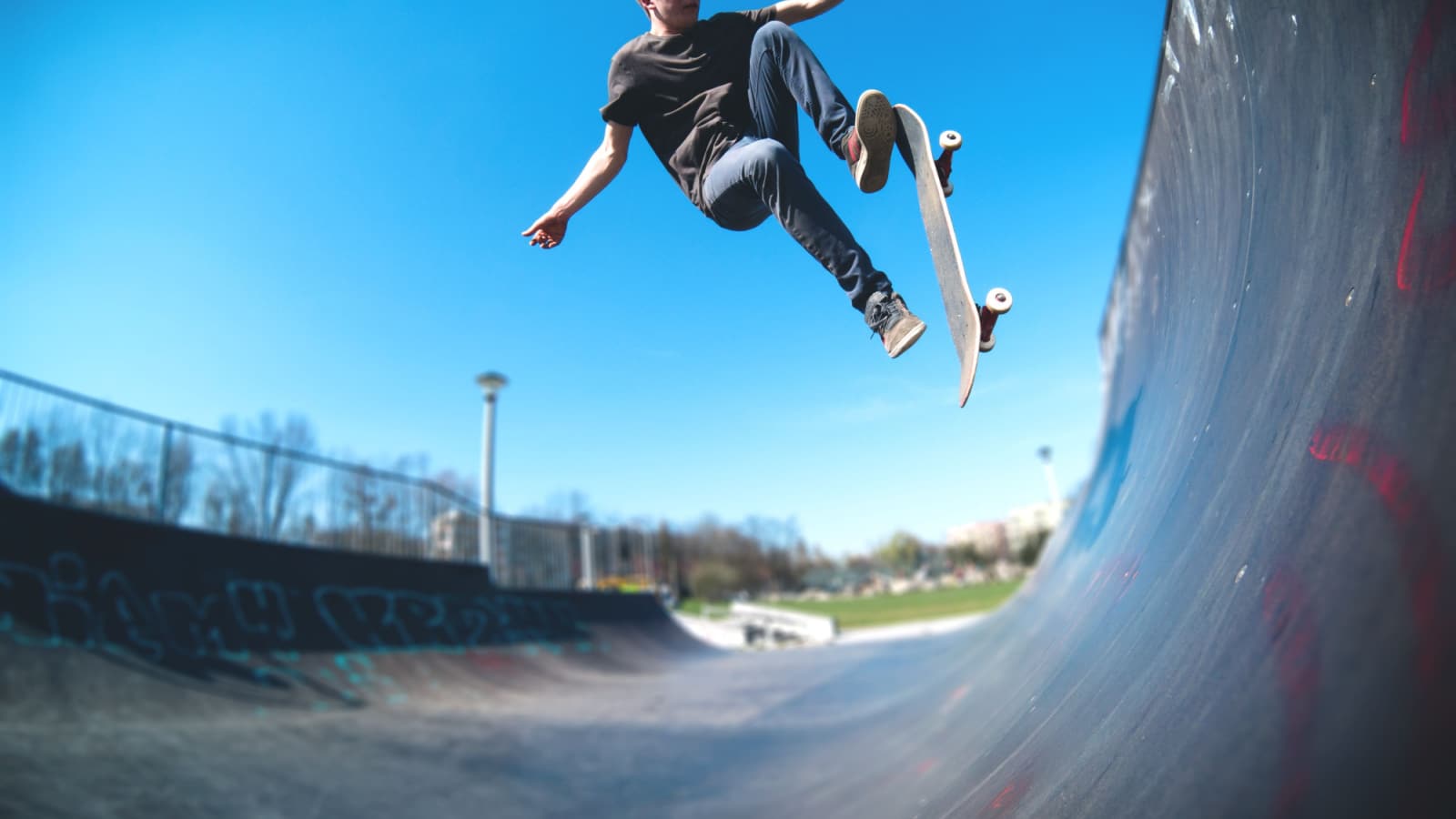 Skateboarder doing ollie on ramp