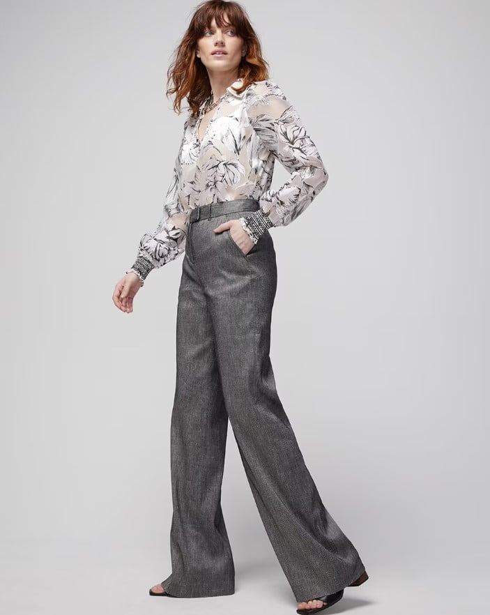 Woman modeling white house black market outfit grey trousers and snakeskin blouse