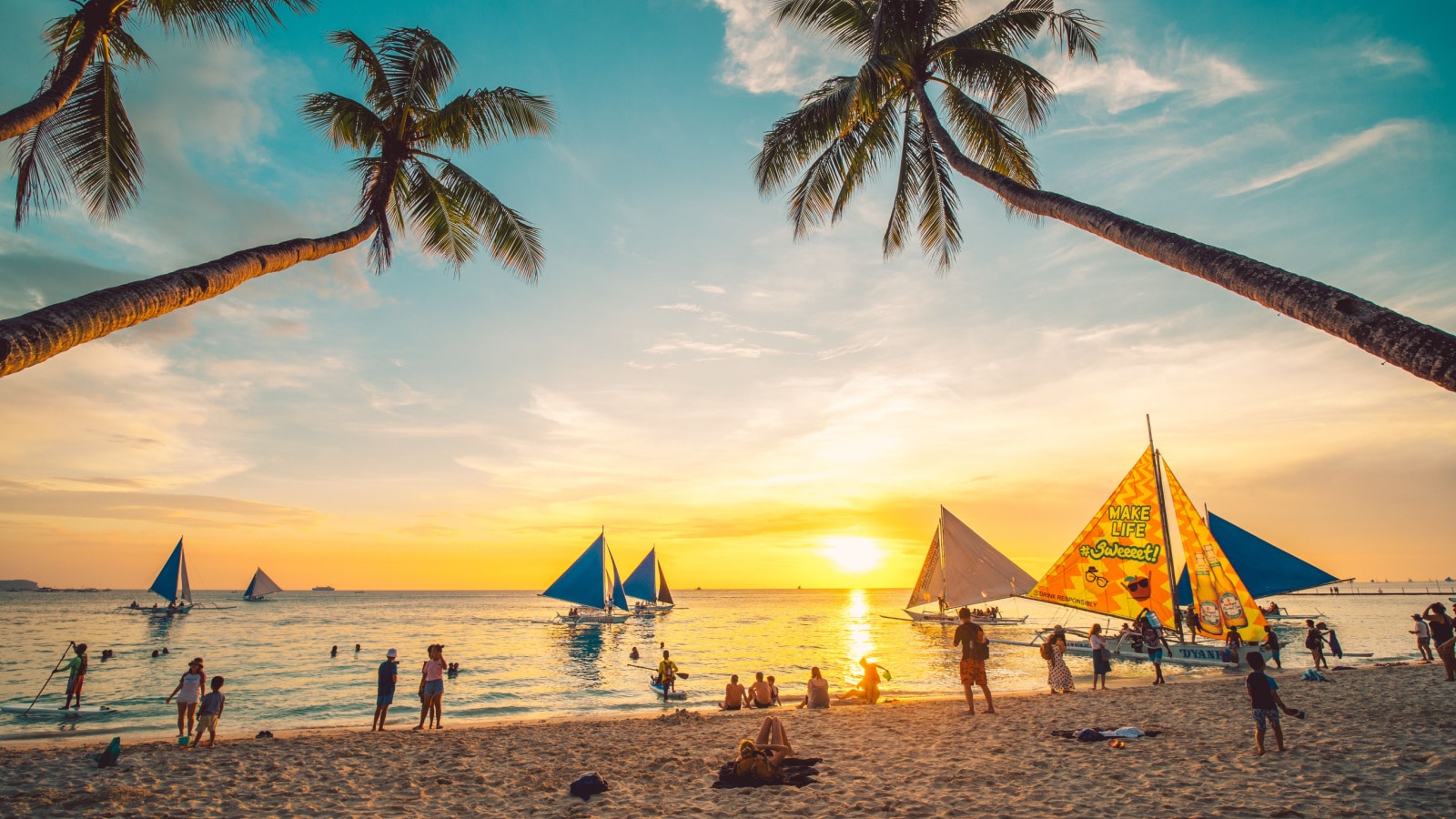 Boracay, Philippines - 12 April 2019: People enjoying a spectacular sunset at Boracay island in Philippines.