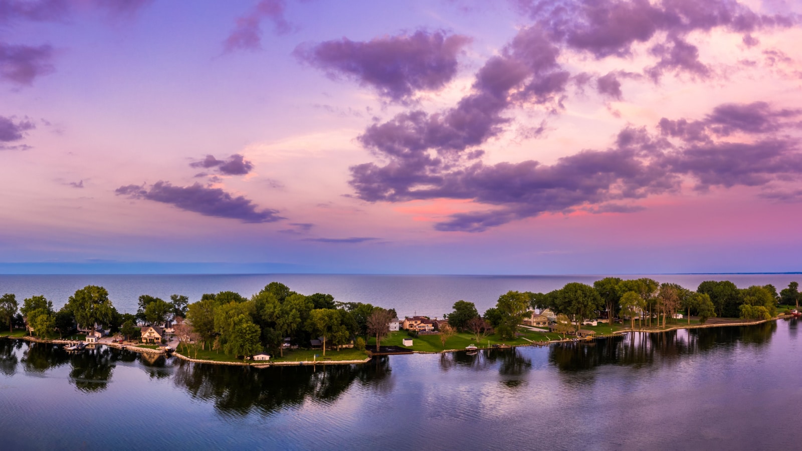 Aerial panorama of the Cedar Point peninsula at dusk, in Sandusky, Ohio, on the Erie lake.