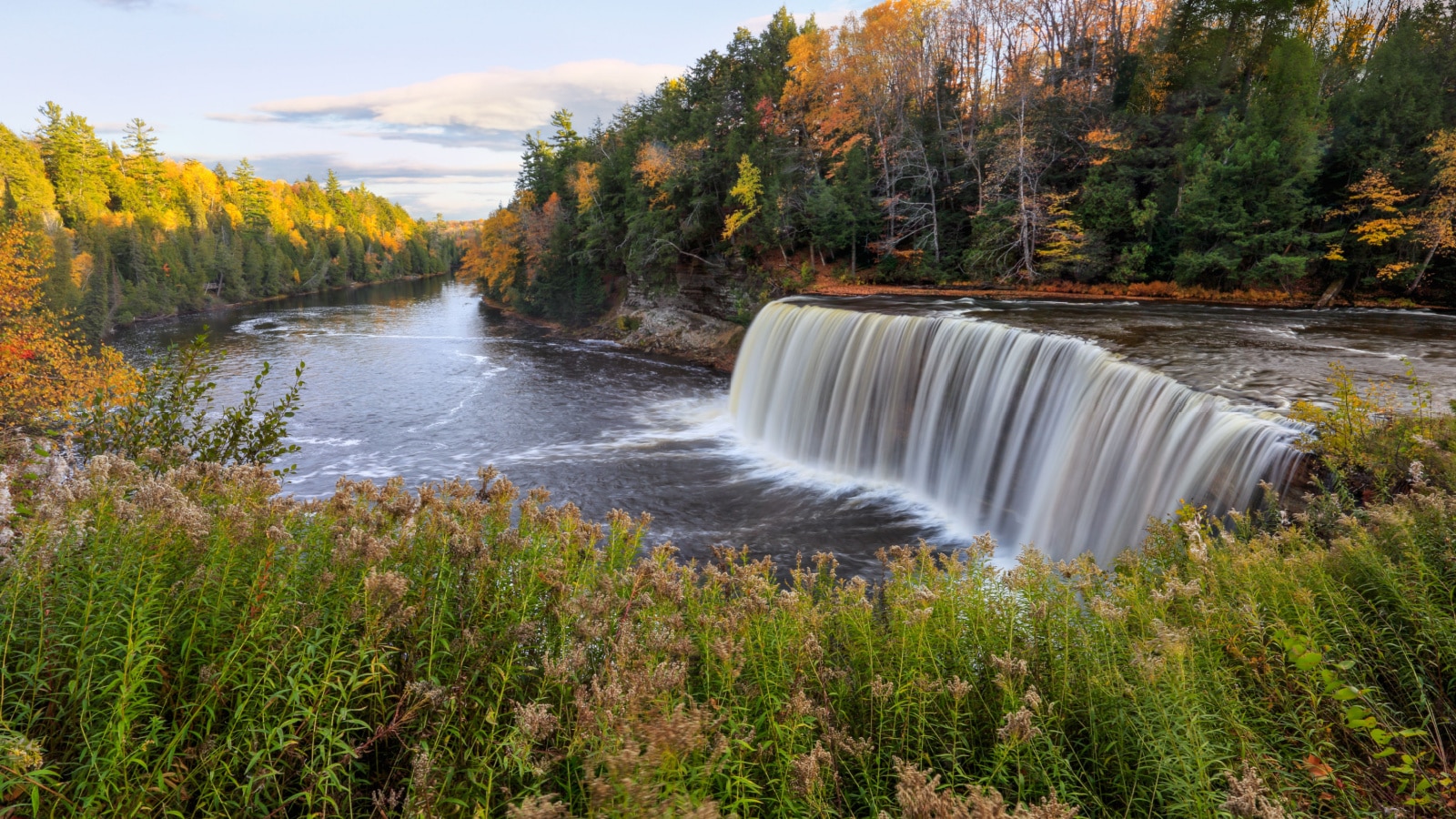 A panoramic view of the very picturesque Tahquamenon Falls and Tahquamenon River during Autumn, Upper Peninsula, Michigan, USA