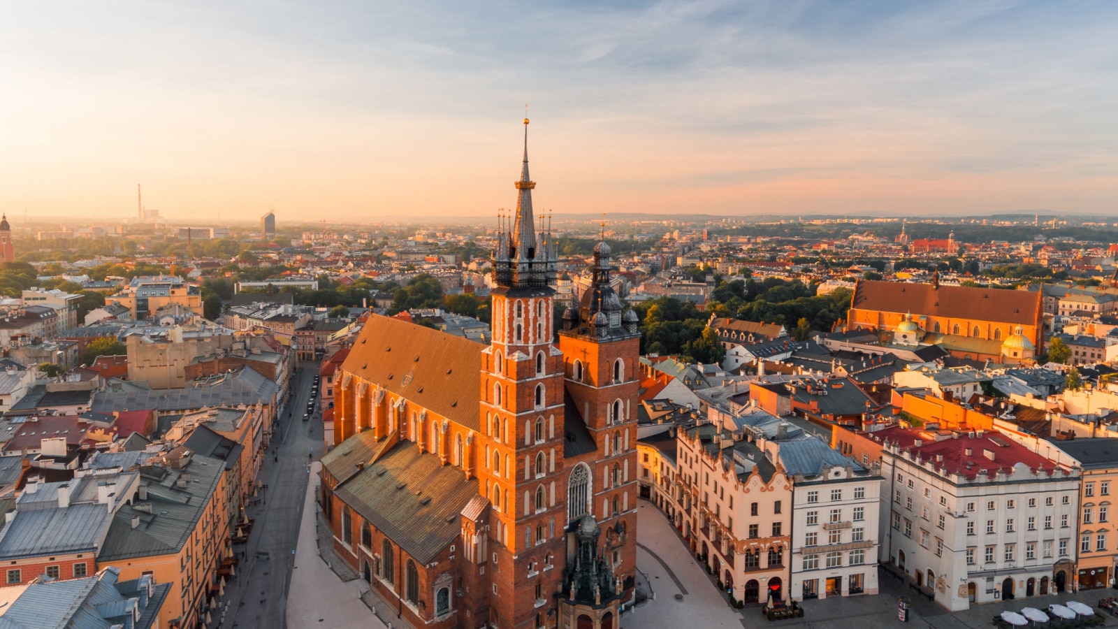 Krakow Market Square from above, aerial view of old city center view in Krakow at morning time, main square, famous cathedral in sun light