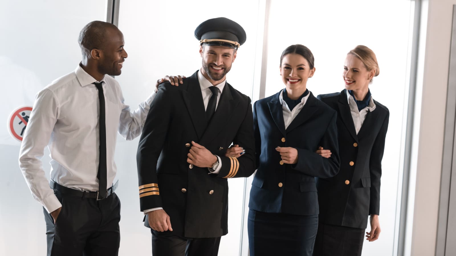 happy aviation personnel team in professional uniform