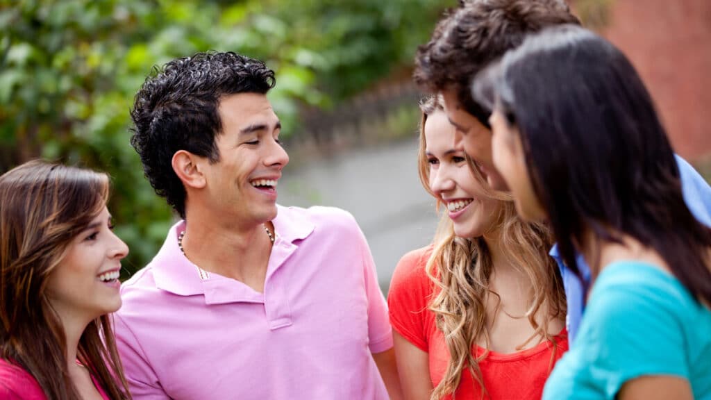 Group of casual young people talking outdoors