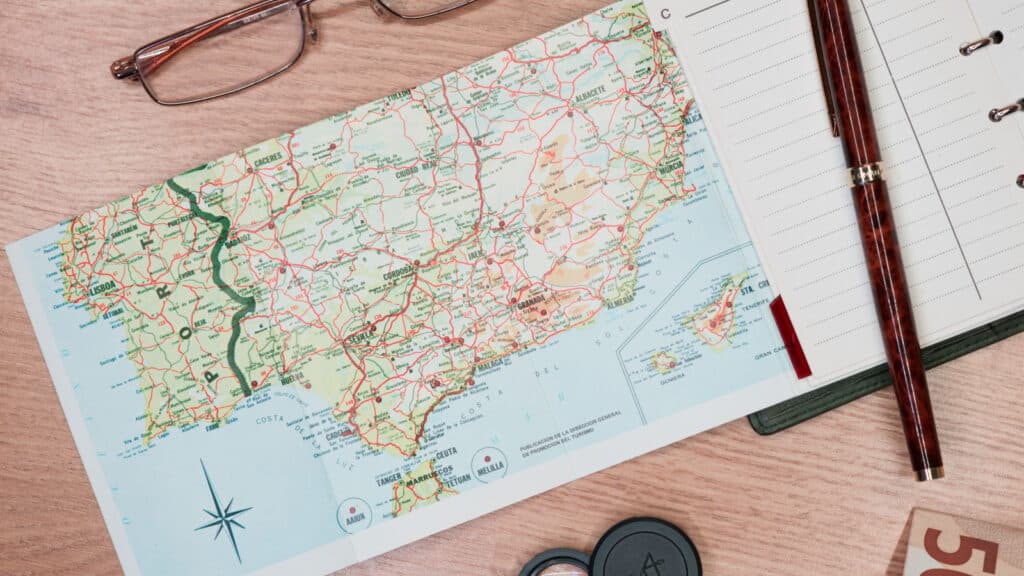 vintage notebook with map on the table, planning a trip