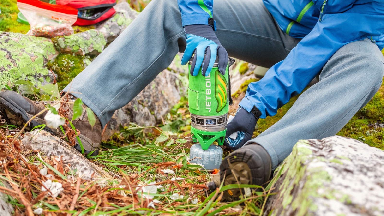 01 SEPTEMBER 2018, UFA, RUSSIA: Man hiker prepares food on a JETBOIL gas burner near the tourist camp