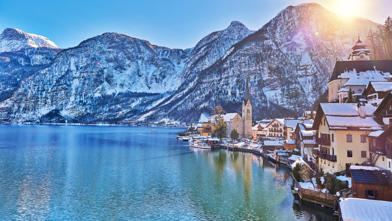 Beautiful winter landscape of Hallstatt mountain village with Hallstatter lake in Austrian Alps. Wide Panorama