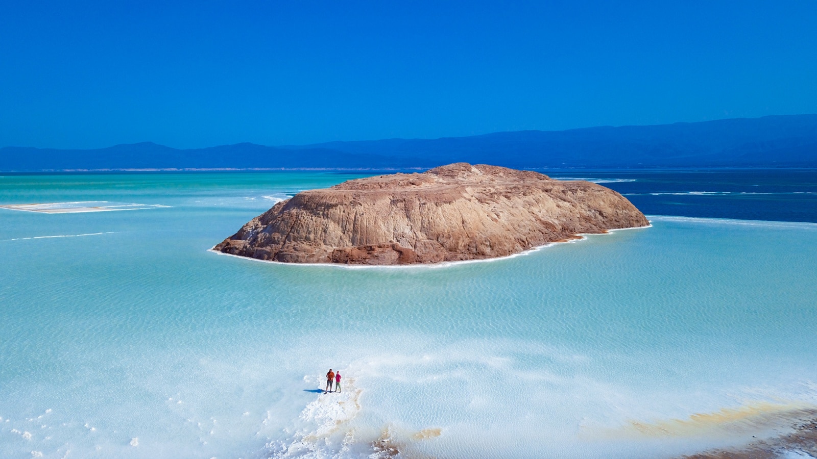 Nobember 07, 2019: Aerial View to Tourists on the Blue Salty Lake Assal