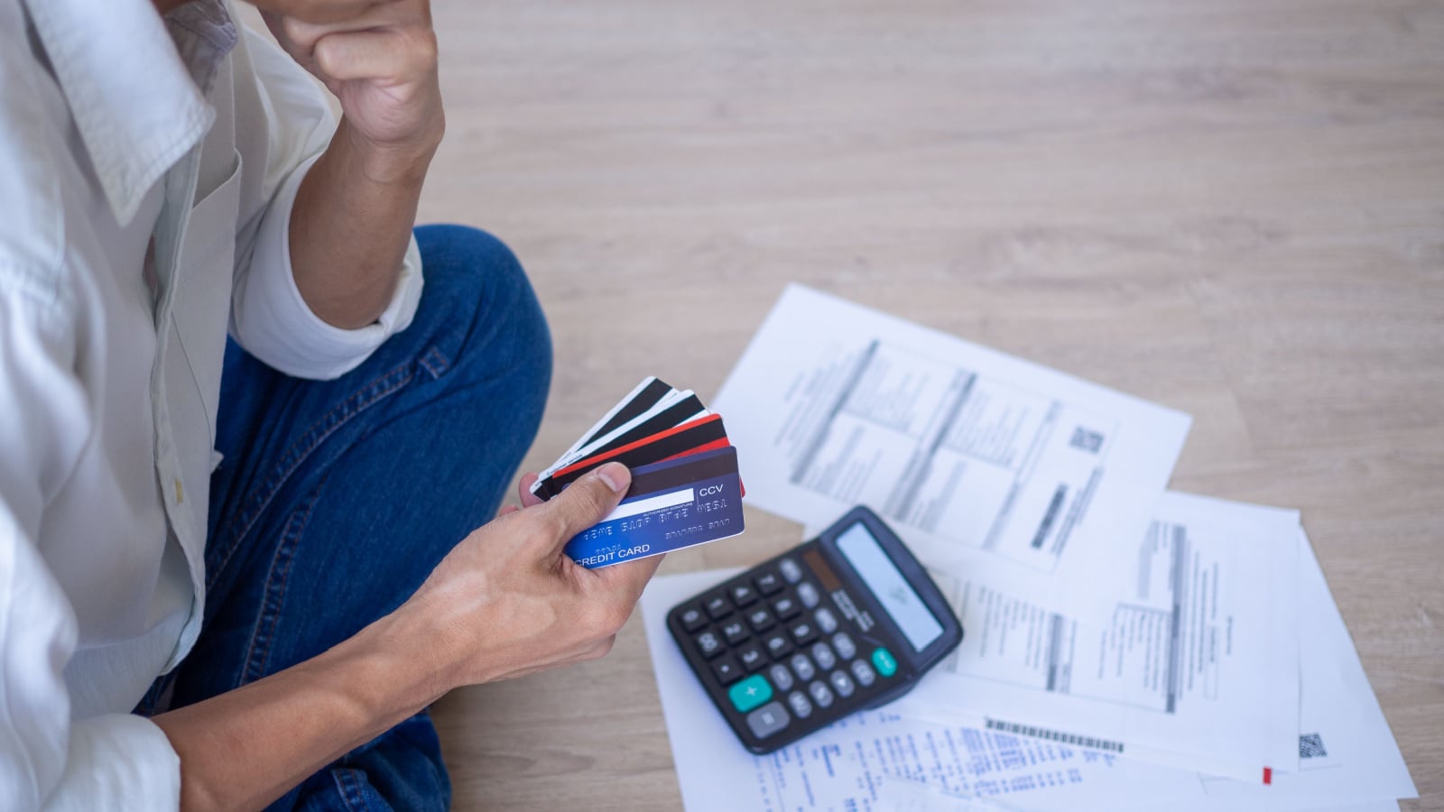 Business men sitting stressed out with home expenses and monthly credit card debt.