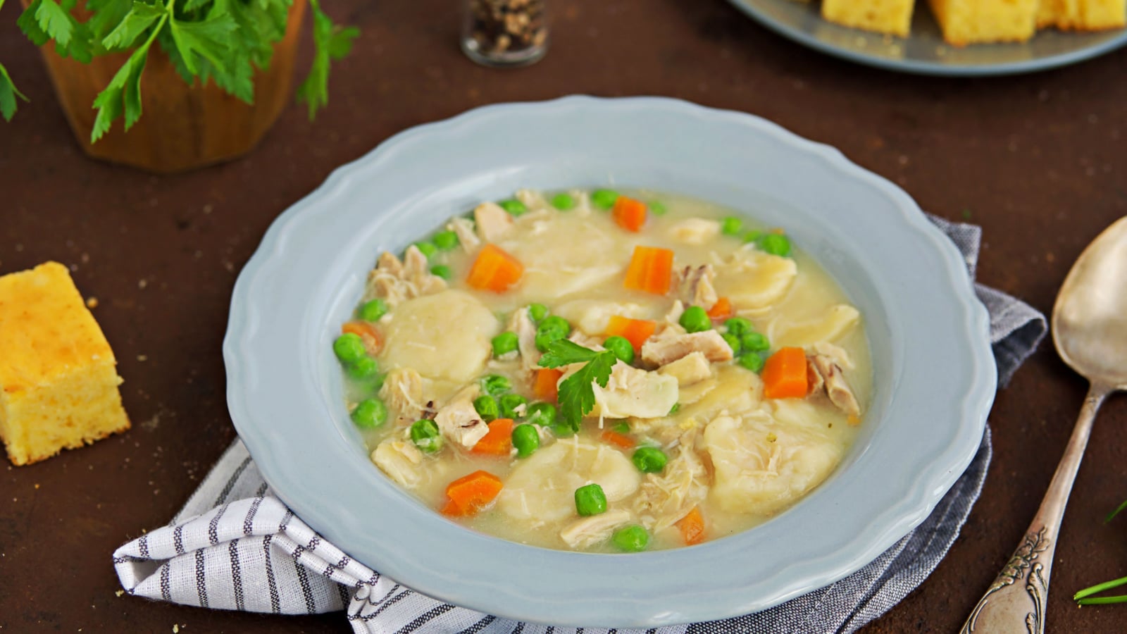 Traditional dish of the American South, dumplings and chicken, green peas in a gray ceramic plate on a brown concrete background. Family meals. American food. Served with cornbread Photo Formats 6000 × 4000 pixels • 50.8 × 33.9 cm • DPI 300 • JPG 1000 × 667 pixels • 8.5 × 5.6 cm • DPI 300 • JPG 500 × 334 pixels • 4.2 × 2.8 cm • DPI 300 • JPG