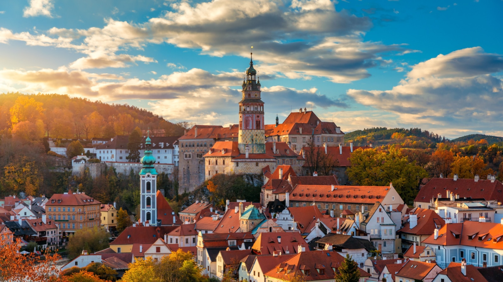 View of historical centre of Cesky Krumlov town on Vltava riverbank on autumn day overlooking medieval Castle, Czech Republic. View of old town of Cesky Krumlov, South Bohemia, Czech Republic.