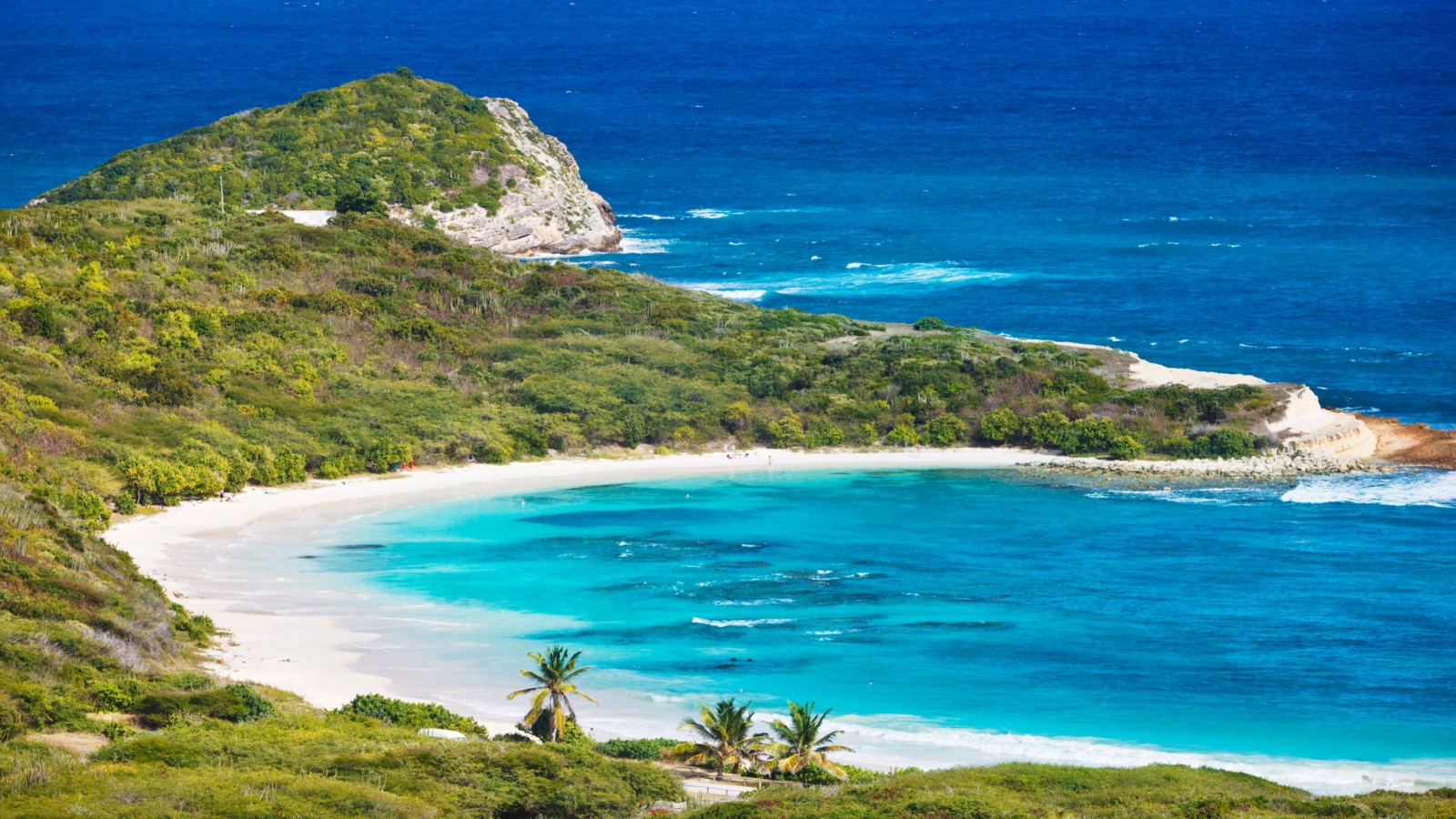 The beautiful Half Moon Bay in Antigua seen from above.