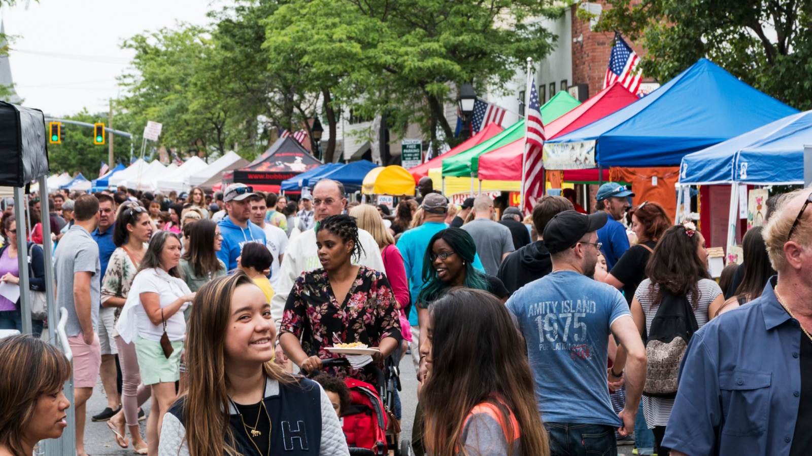 Bay Shore, NY, USA - 10 June 2018: The Hamlet of Bay shore on Long Island streets are crowded with vendors and people during their annual community street fair.