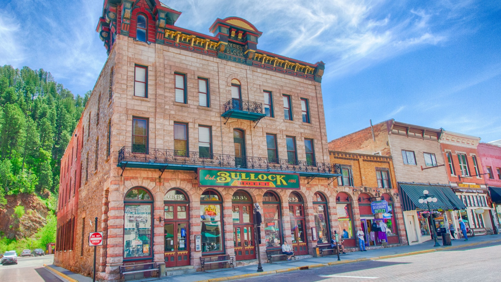 Deadwood, South Dakota, USA, June 6, 2018: Tourists walk down mainstreet in Deadwood, South Dakota outside the Bullock hotel.